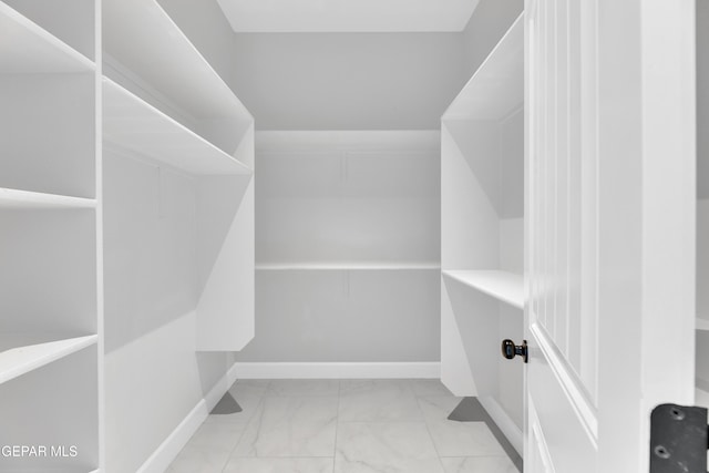 7549 Enchanted Park Dr 706849, El Paso, TX 79911 - walk in closet with marble look tiles