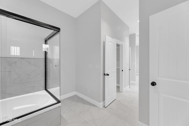 7549 Enchanted Park Dr 706849, El Paso, TX 79911 - bathroom featuring marble look tiles and a garden tub