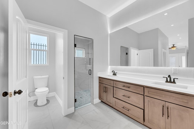 7549 Enchanted Park Dr 706849, El Paso, TX 79911 - bathroom with double vanity, a shower stall, a ceiling fan, and marble finish flooring