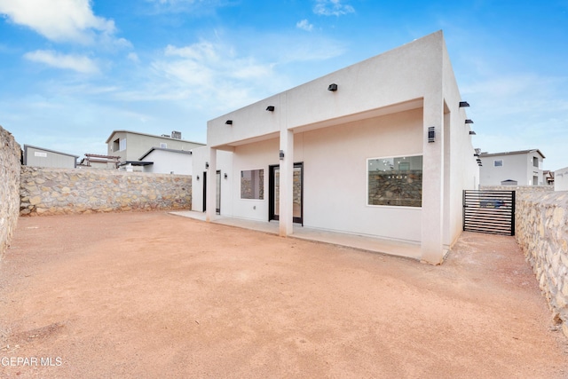 7549 Enchanted Park Dr 706849, El Paso, TX 79911 - back of house with a fenced backyard, a patio, and stucco siding