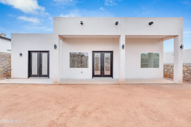 7549 Enchanted Park Dr 706849, El Paso, TX 79911 - rear view of house featuring french doors and stucco siding