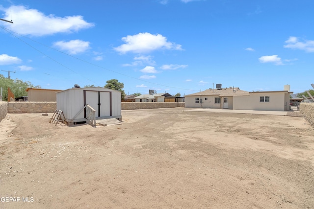 224 Ben Swain Dr, El Paso, TX 79915 - fenced backyard with a storage shed