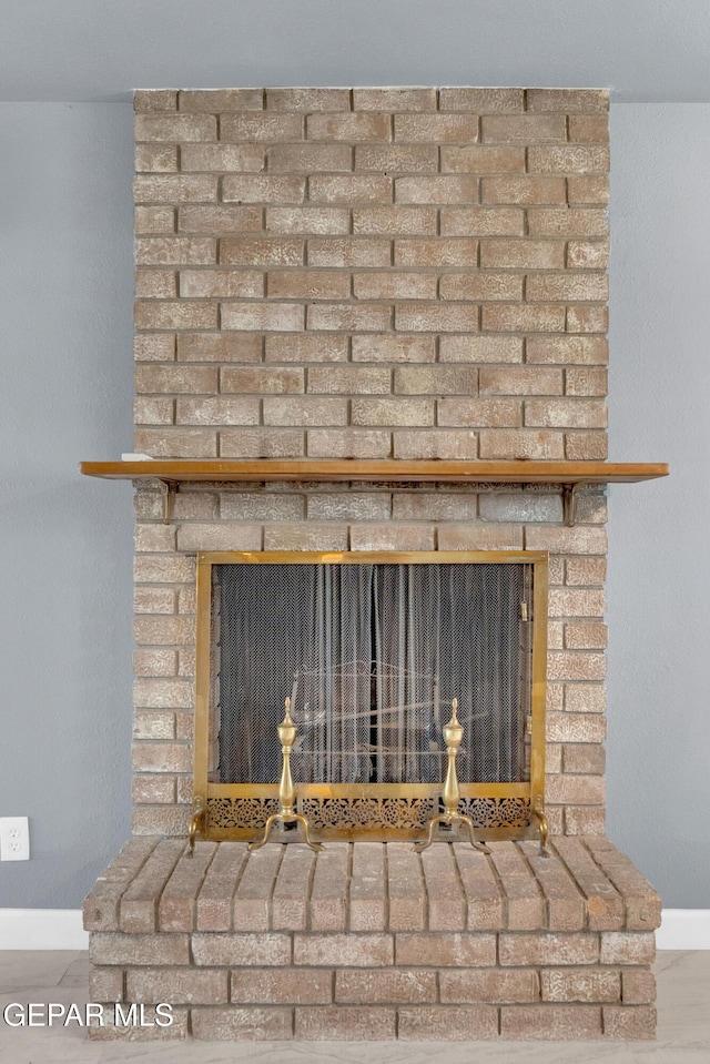 224 Ben Swain Dr, El Paso, TX 79915 - detailed view of a brick fireplace and baseboards