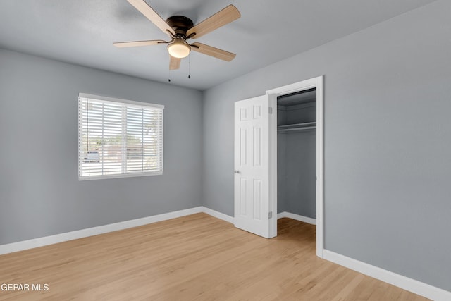 224 Ben Swain Dr, El Paso, TX 79915 - unfurnished bedroom with light wood-style flooring, ceiling fan, and a walk in closet