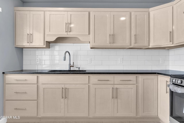 224 Ben Swain Dr, El Paso, TX 79915 - kitchen featuring stainless steel electric range, tasteful backsplash, and dark stone counters