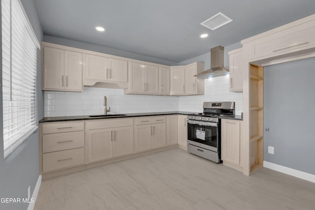 224 Ben Swain Dr, El Paso, TX 79915 - kitchen featuring wall chimney exhaust hood, gas range, healthy amount of natural light, backsplash, and recessed lighting