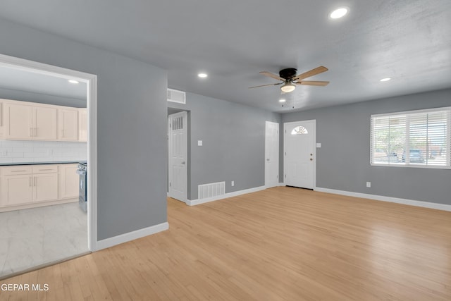 224 Ben Swain Dr, El Paso, TX 79915 - unfurnished living room with a ceiling fan, recessed lighting, and light wood-style flooring