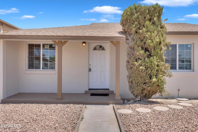 224 Ben Swain Dr, El Paso, TX 79915 - property entrance featuring stucco siding and a shingled roof