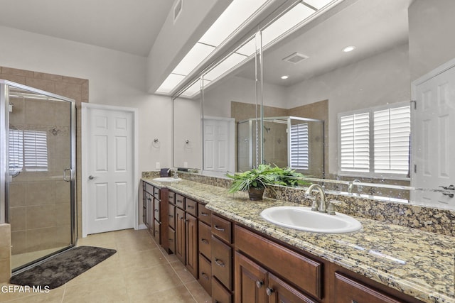 6688 Tuscany Ridge Dr, El Paso, TX 79912 - bathroom featuring double vanity, a stall shower, and tile patterned floors