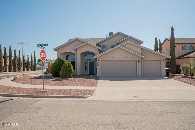 448 Ghost Flower St, Horizon City, TX 79928 - view of front of home featuring stucco siding, an attached garage, and driveway