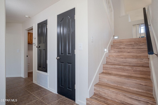 448 Ghost Flower St, Horizon City, TX 79928 - stairs featuring tile patterned flooring and baseboards