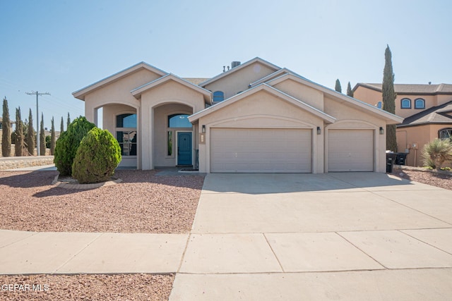 448 Ghost Flower St, Horizon City, TX 79928 - view of front facade with stucco siding, concrete driveway, and a garage