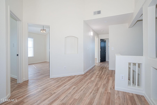 448 Ghost Flower St, Horizon City, TX 79928 - hall featuring light wood-style flooring and a high ceiling
