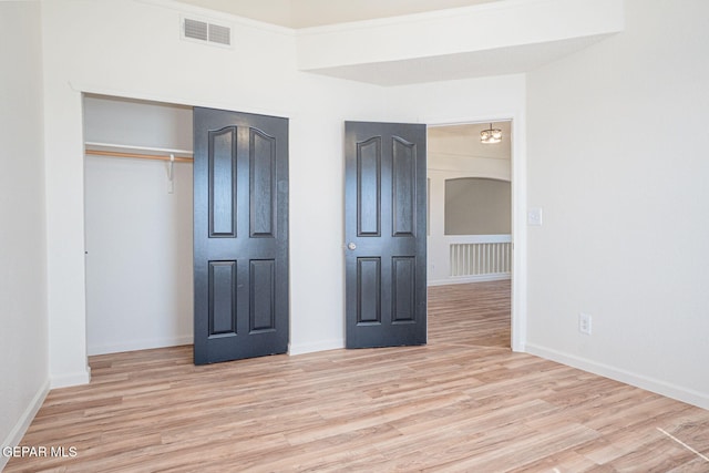 448 Ghost Flower St, Horizon City, TX 79928 - unfurnished bedroom featuring wood finished floors and a closet