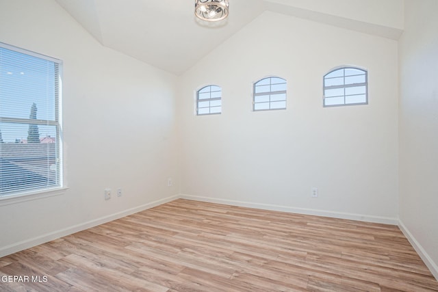 448 Ghost Flower St, Horizon City, TX 79928 - unfurnished room featuring healthy amount of natural light, vaulted ceiling, and light wood-style floors