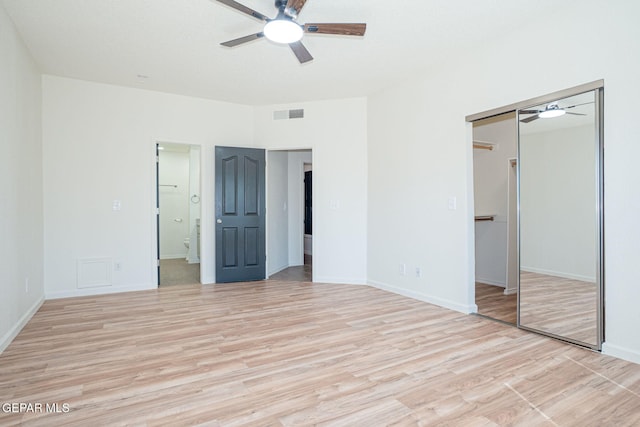 448 Ghost Flower St, Horizon City, TX 79928 - unfurnished bedroom with light wood-style flooring, a closet, ensuite bath, and ceiling fan