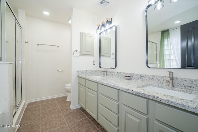 448 Ghost Flower St, Horizon City, TX 79928 - bathroom featuring double vanity, a tile shower, tile patterned floors, and recessed lighting