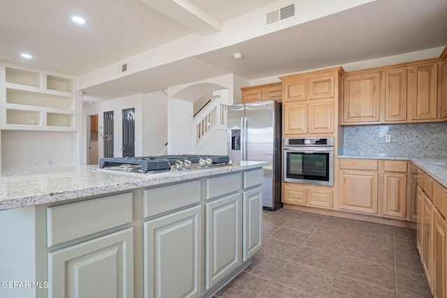 448 Ghost Flower St, Horizon City, TX 79928 - kitchen with stainless steel appliances, backsplash, tile patterned flooring, light stone counters, and recessed lighting