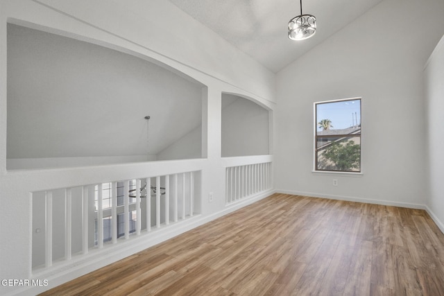 448 Ghost Flower St, Horizon City, TX 79928 - empty room with high vaulted ceiling and wood finished floors