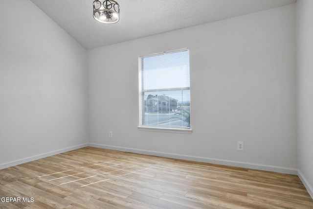 448 Ghost Flower St, Horizon City, TX 79928 - empty room featuring light wood-style floors and lofted ceiling