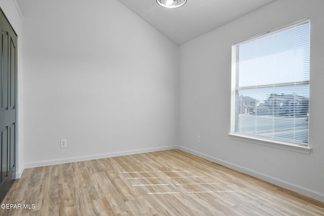 448 Ghost Flower St, Horizon City, TX 79928 - spare room featuring light wood-style floors and vaulted ceiling