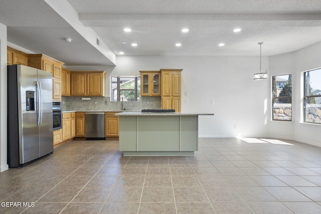 448 Ghost Flower St, Horizon City, TX 79928 - kitchen with appliances with stainless steel finishes, a textured ceiling, tasteful backsplash, recessed lighting, and light tile patterned floors