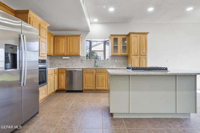 448 Ghost Flower St, Horizon City, TX 79928 - kitchen with appliances with stainless steel finishes, decorative backsplash, recessed lighting, light stone countertops, and a textured ceiling
