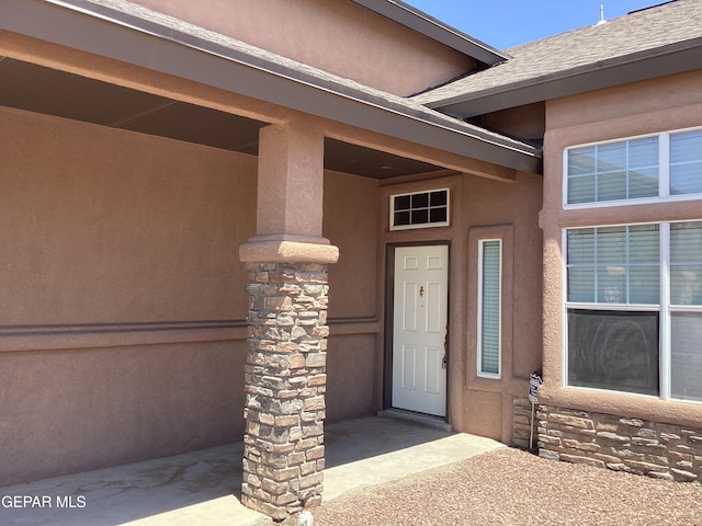 683 Juan Munoz Ct, El Paso, TX 79932 - doorway to property with stucco siding and stone siding