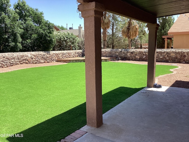 683 Juan Munoz Ct, El Paso, TX 79932 - fenced backyard with a patio