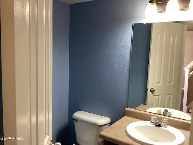 683 Juan Munoz Ct, El Paso, TX 79932 - bathroom with vanity and a textured wall
