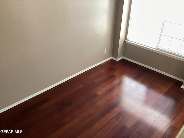 683 Juan Munoz Ct, El Paso, TX 79932 - spare room featuring dark wood-style flooring and baseboards