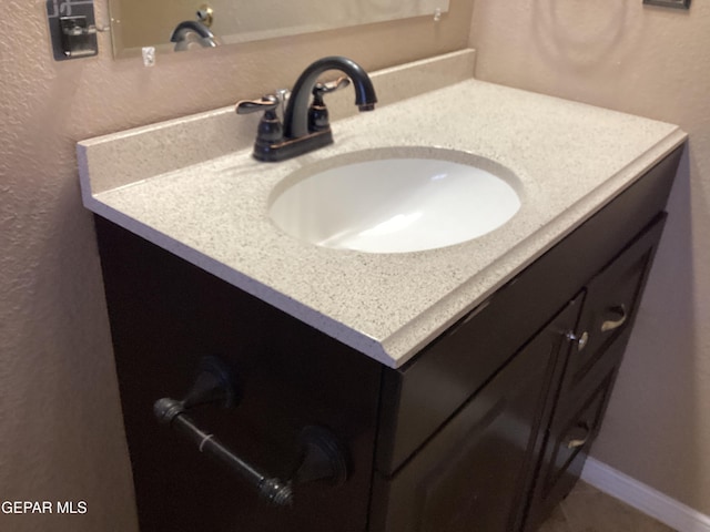683 Juan Munoz Ct, El Paso, TX 79932 - bathroom with vanity and a textured wall