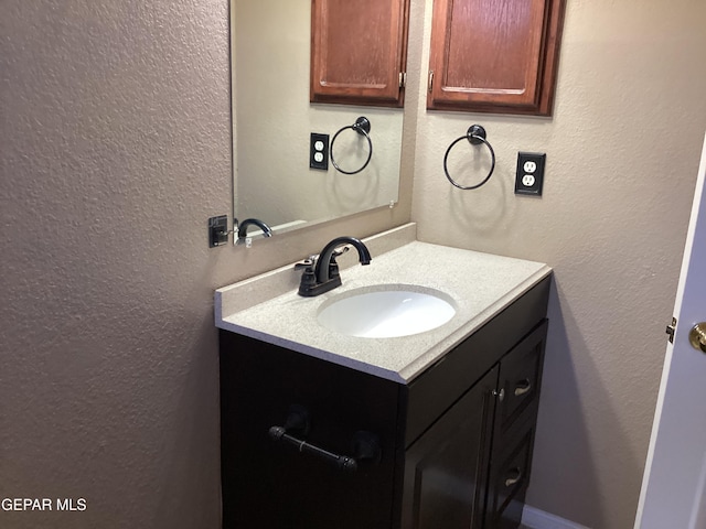 683 Juan Munoz Ct, El Paso, TX 79932 - bathroom with vanity and a textured wall
