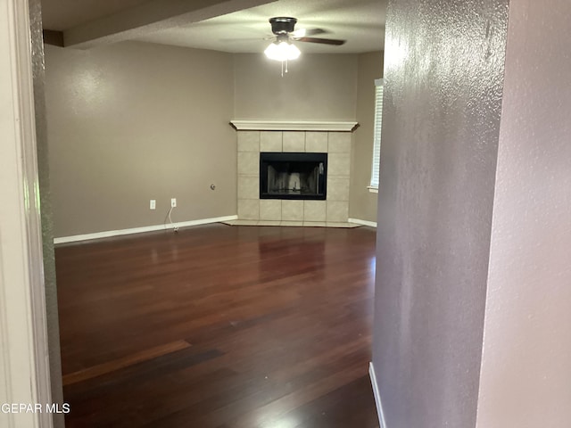 683 Juan Munoz Ct, El Paso, TX 79932 - unfurnished living room featuring ceiling fan, wood finished floors, and a fireplace