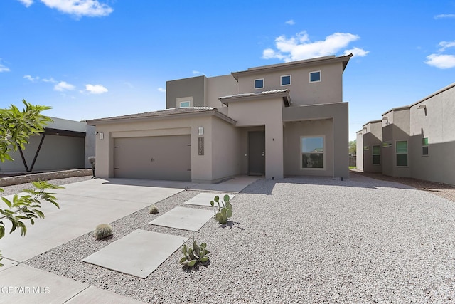 13594 Gatton St, El Paso, TX 79928 - view of front of property with stucco siding, concrete driveway, and a garage