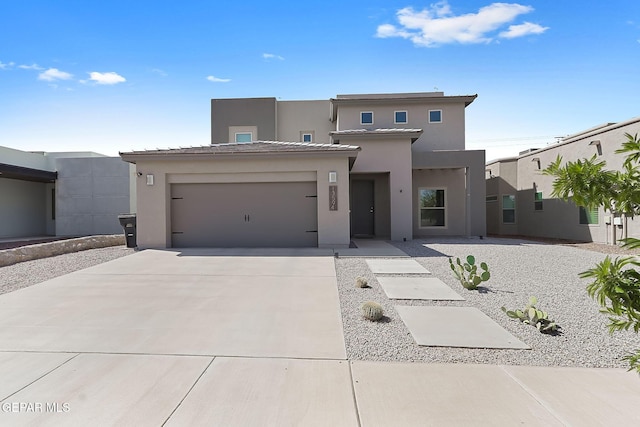 13594 Gatton St, El Paso, TX 79928 - view of front of property featuring driveway, stucco siding, and a garage