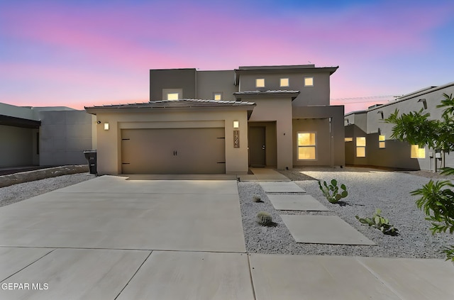 13594 Gatton St, El Paso, TX 79928 - view of front of house featuring driveway, stucco siding, and a garage