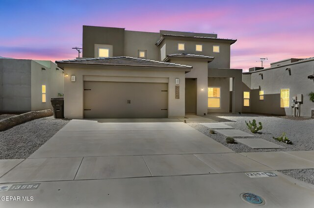 13594 Gatton St, El Paso, TX 79928 - view of front of home featuring driveway, stucco siding, and an attached garage