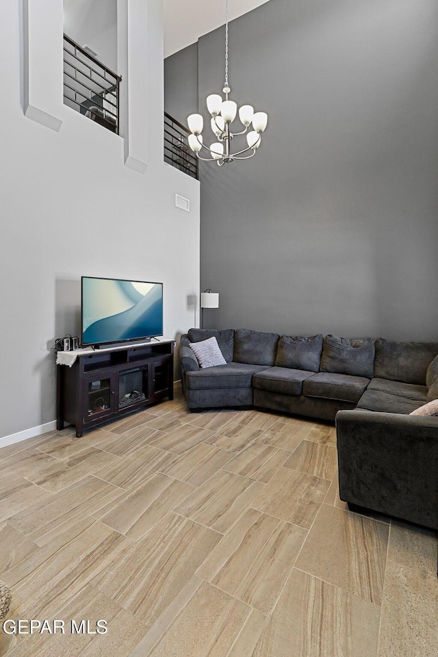 13594 Gatton St, El Paso, TX 79928 - living room with a chandelier and a towering ceiling