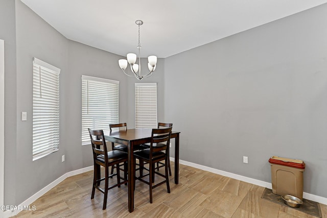 13594 Gatton St, El Paso, TX 79928 - dining area featuring light wood-style flooring and a chandelier