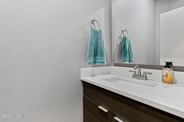 13594 Gatton St, El Paso, TX 79928 - bathroom featuring vanity and a textured wall