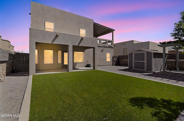 13594 Gatton St, El Paso, TX 79928 - rear view of property featuring a storage shed, a patio, a balcony, and stucco siding