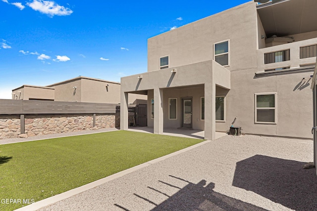 13594 Gatton St, El Paso, TX 79928 - rear view of house featuring stucco siding, a patio, and a fenced backyard