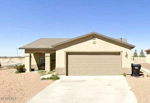 813 Nuevo Desierto Dr, Horizon City, TX 79928 - ranch-style house featuring an attached garage, concrete driveway, and stucco siding