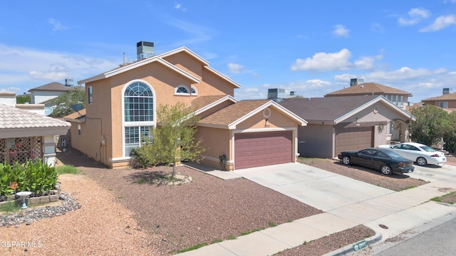 11905 Jim Webb Dr, El Paso, TX 79934 - view of front of property featuring an attached garage, stucco siding, and concrete driveway