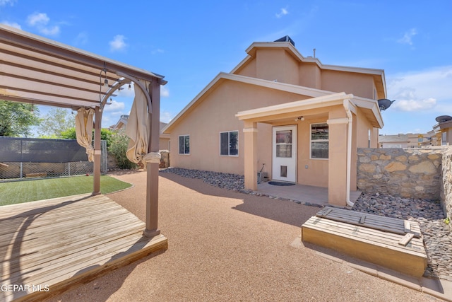 11905 Jim Webb Dr, El Paso, TX 79934 - back of house featuring stucco siding, a patio, and a pergola