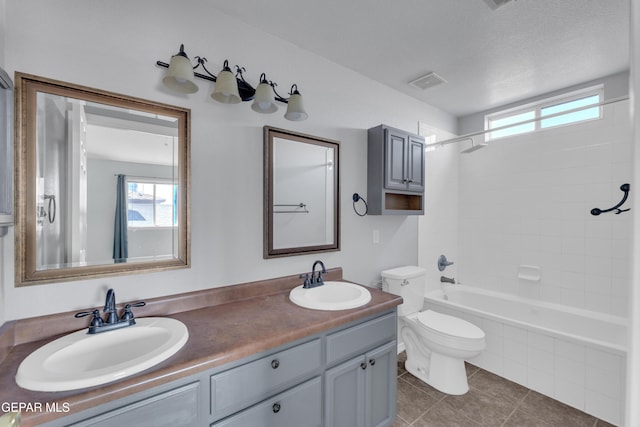 11905 Jim Webb Dr, El Paso, TX 79934 - bathroom featuring double vanity, plenty of natural light, tile patterned flooring, and bathing tub / shower combination