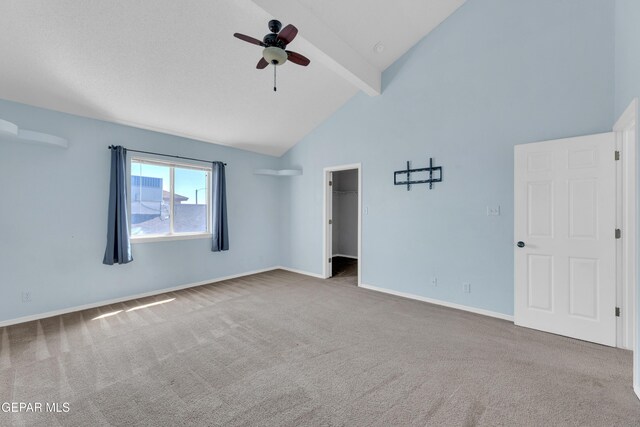 11905 Jim Webb Dr, El Paso, TX 79934 - carpeted spare room featuring beamed ceiling, ceiling fan, and high vaulted ceiling