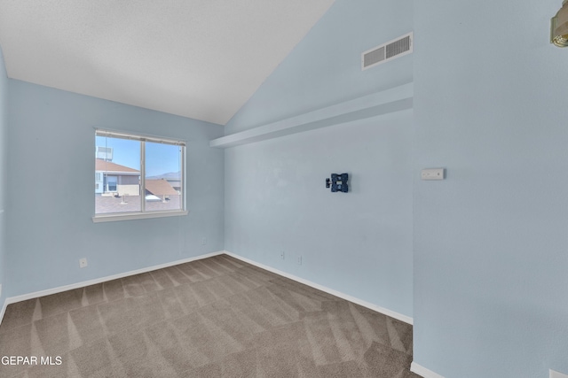 11905 Jim Webb Dr, El Paso, TX 79934 - carpeted empty room featuring lofted ceiling and baseboards