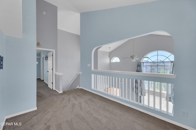 11905 Jim Webb Dr, El Paso, TX 79934 - hall with a towering ceiling, carpet, an upstairs landing, and arched walkways